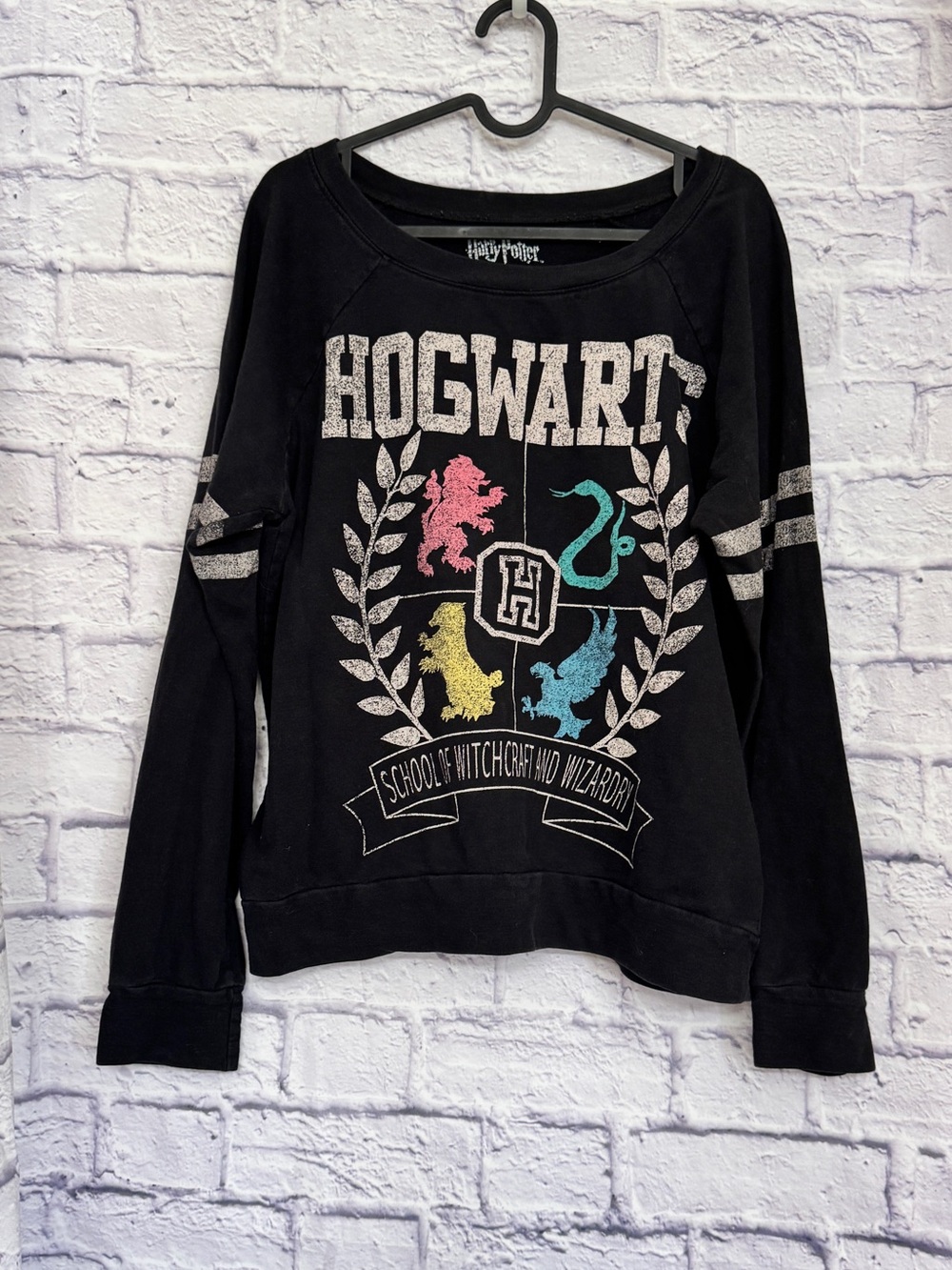 Warner Bros. Hogwarts Black Crewneck Sweatshirt‎ with Multicolor Crest